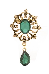 golden vintage brooch with emeralds