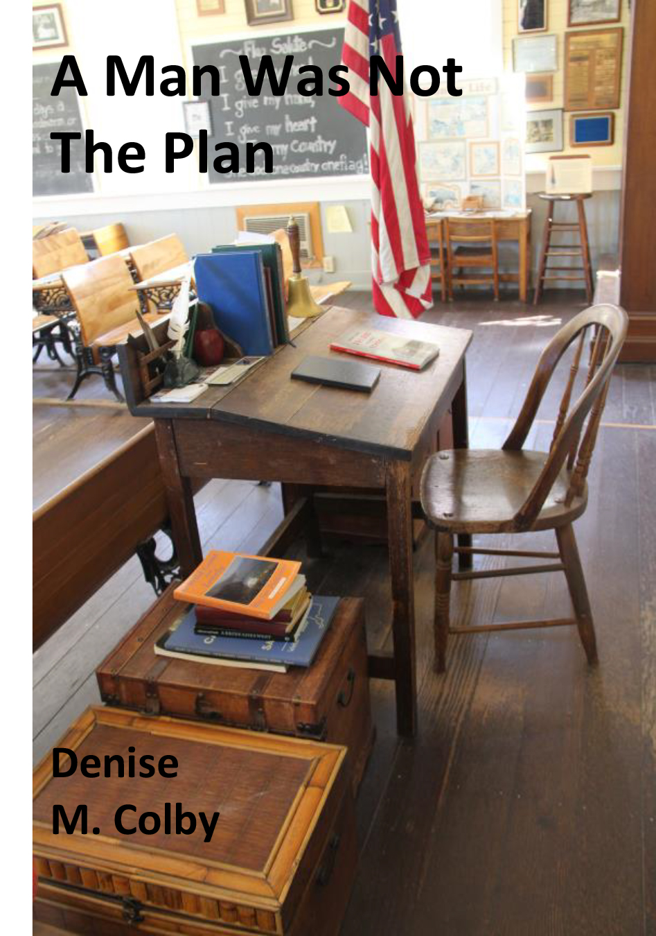 Sample book cover with one-room schoolhouse teacher desk on it by Denise M. Colby