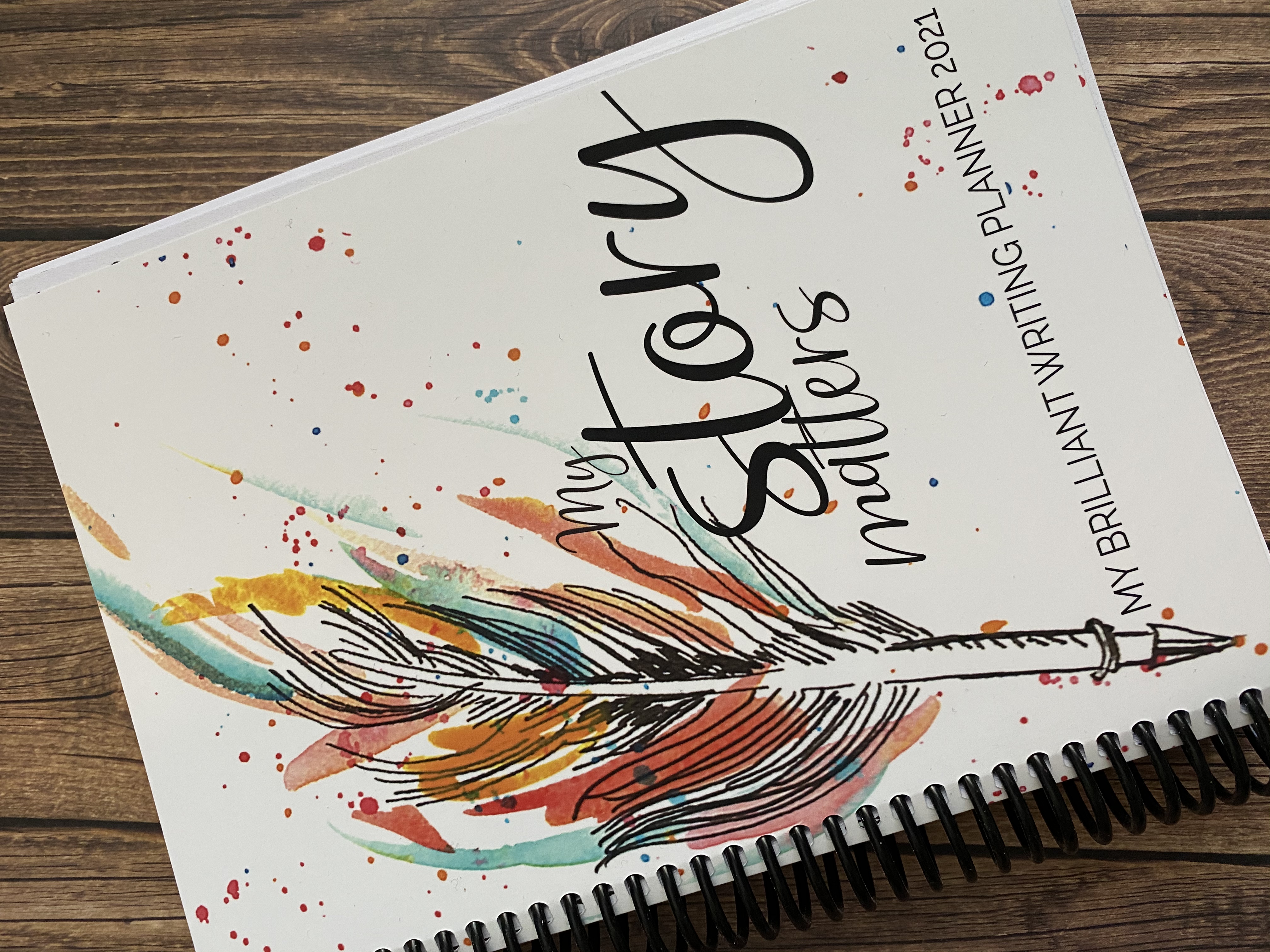This is what the My Brilliant Writing Planner looks like for 2021, with beautifully drawn feather pen and the words My Story Matters