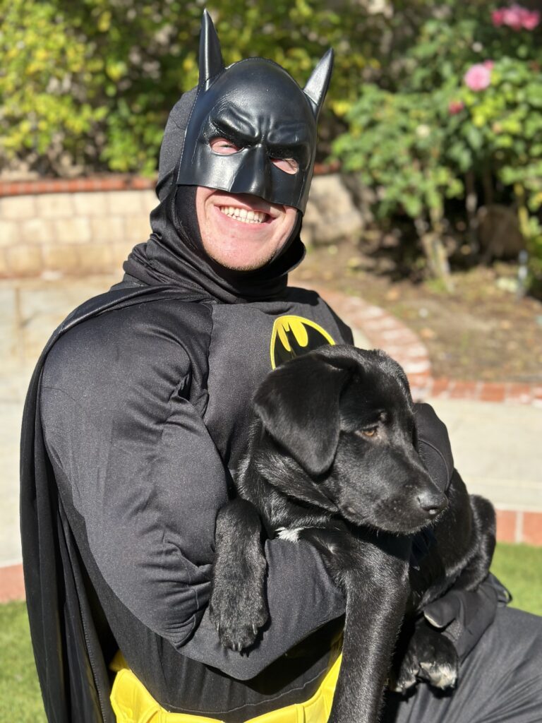 Our son dressed up as batman with his puppy, Ace