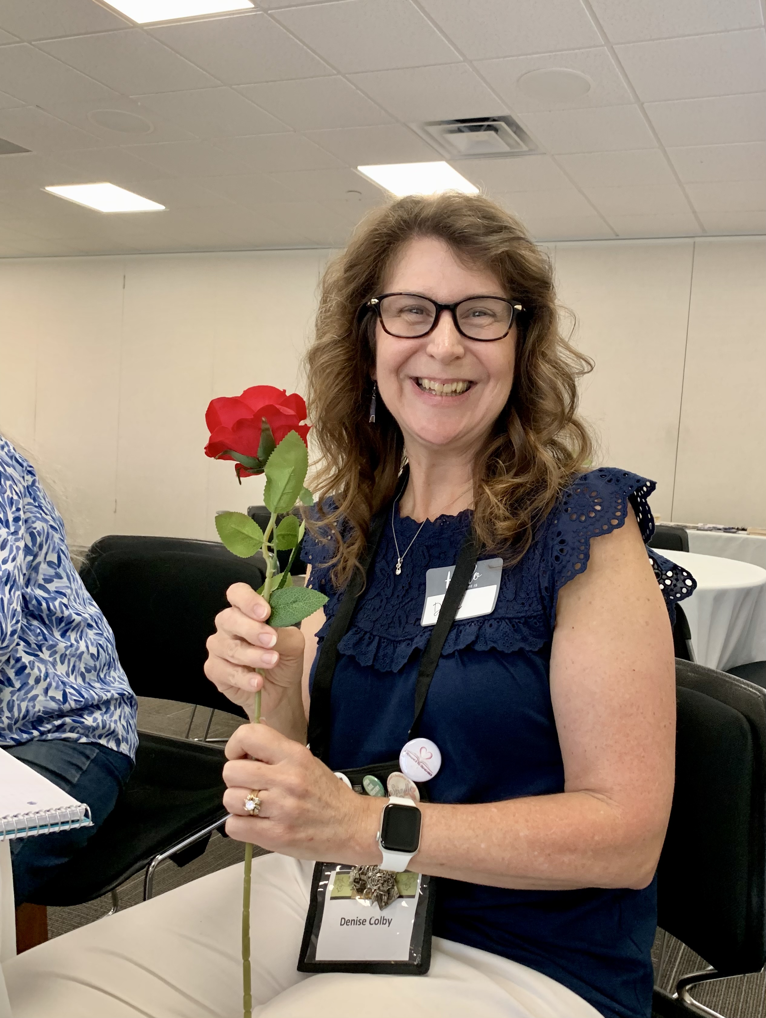 Denise M. Colby with her red rose from the OCRW writing group June 8, 2024