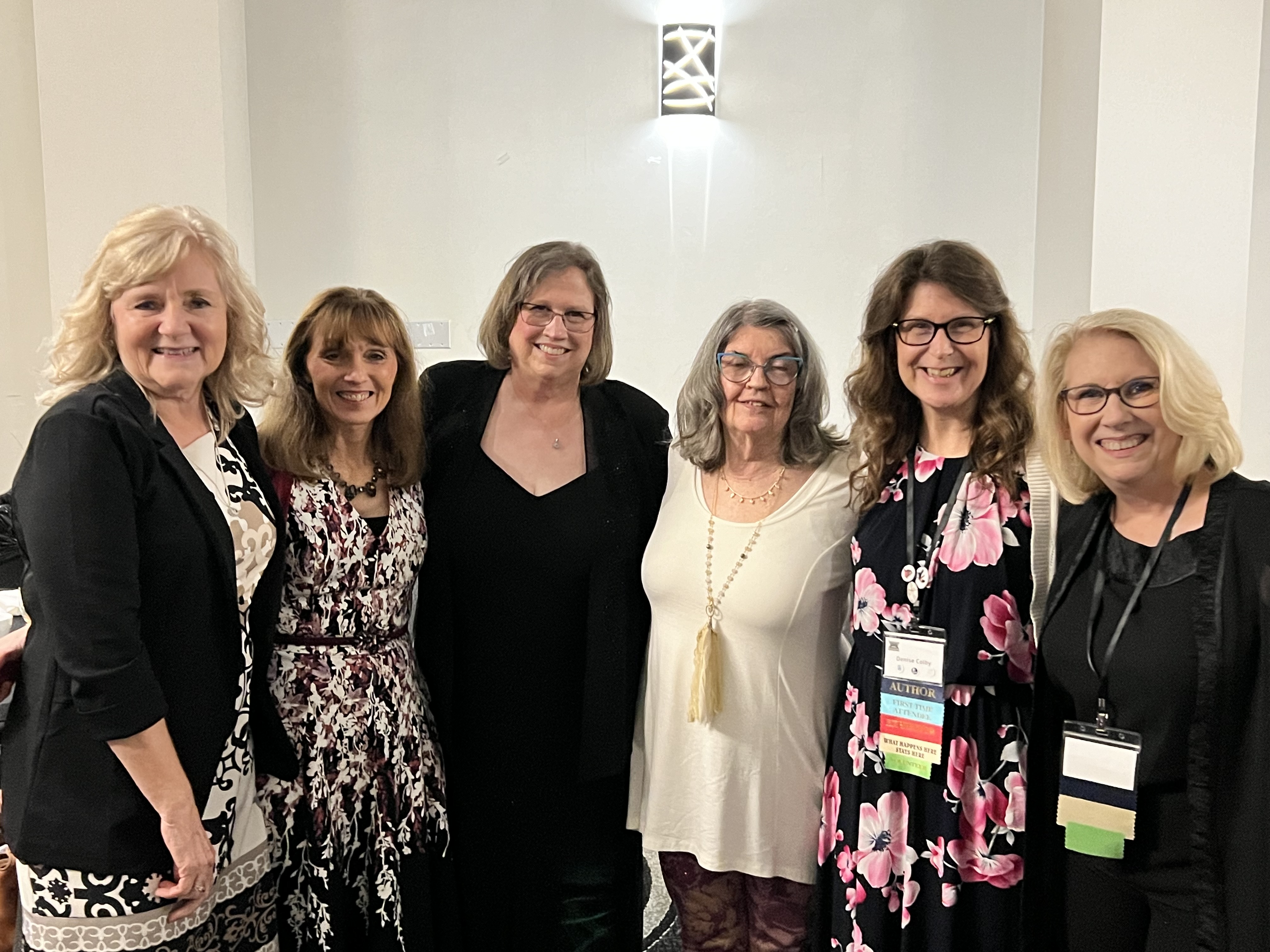 Authors at the ScrivCon 2024 Banquet Gala including Denise M. Colby, Lori DeJong, Donna Wichelman, Teresa Wells, Lynn Watson