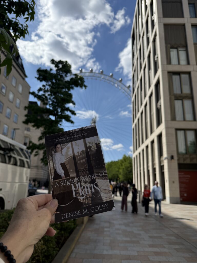 london eye in the background of Denise M. Colby's new book cover