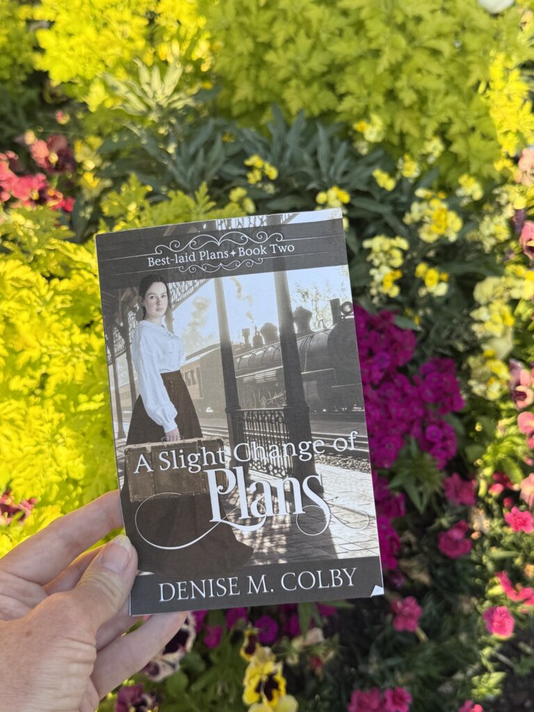 flowers in the background with book cover in front