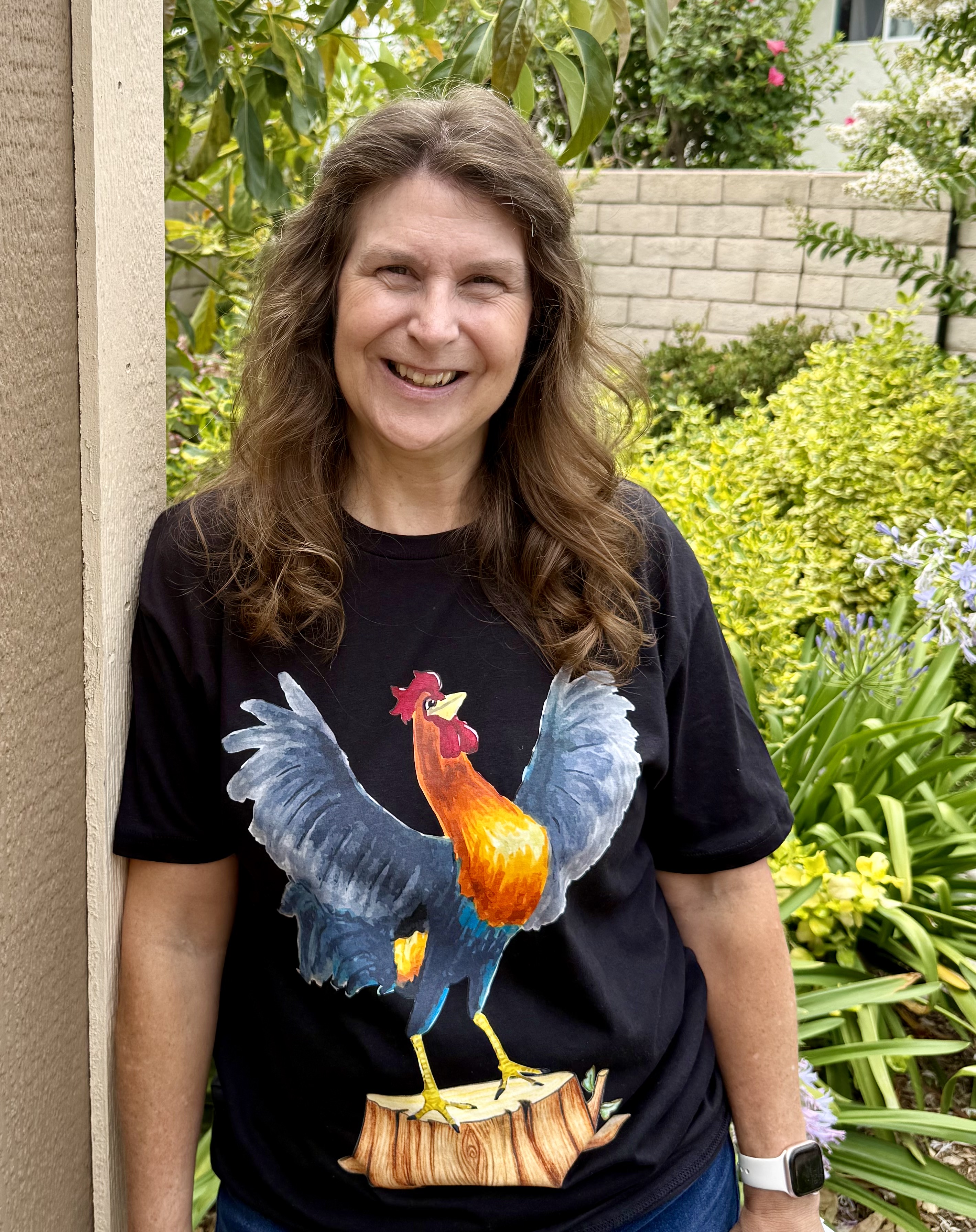 Denise M. Colby wearing Bert the Rooster t-shirt from her Best-laid Plans Series